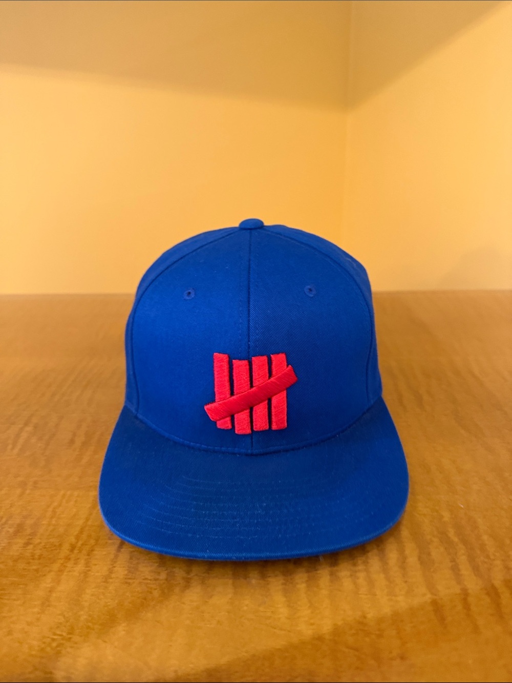 Undefeated Snapback Hat with Red Logo